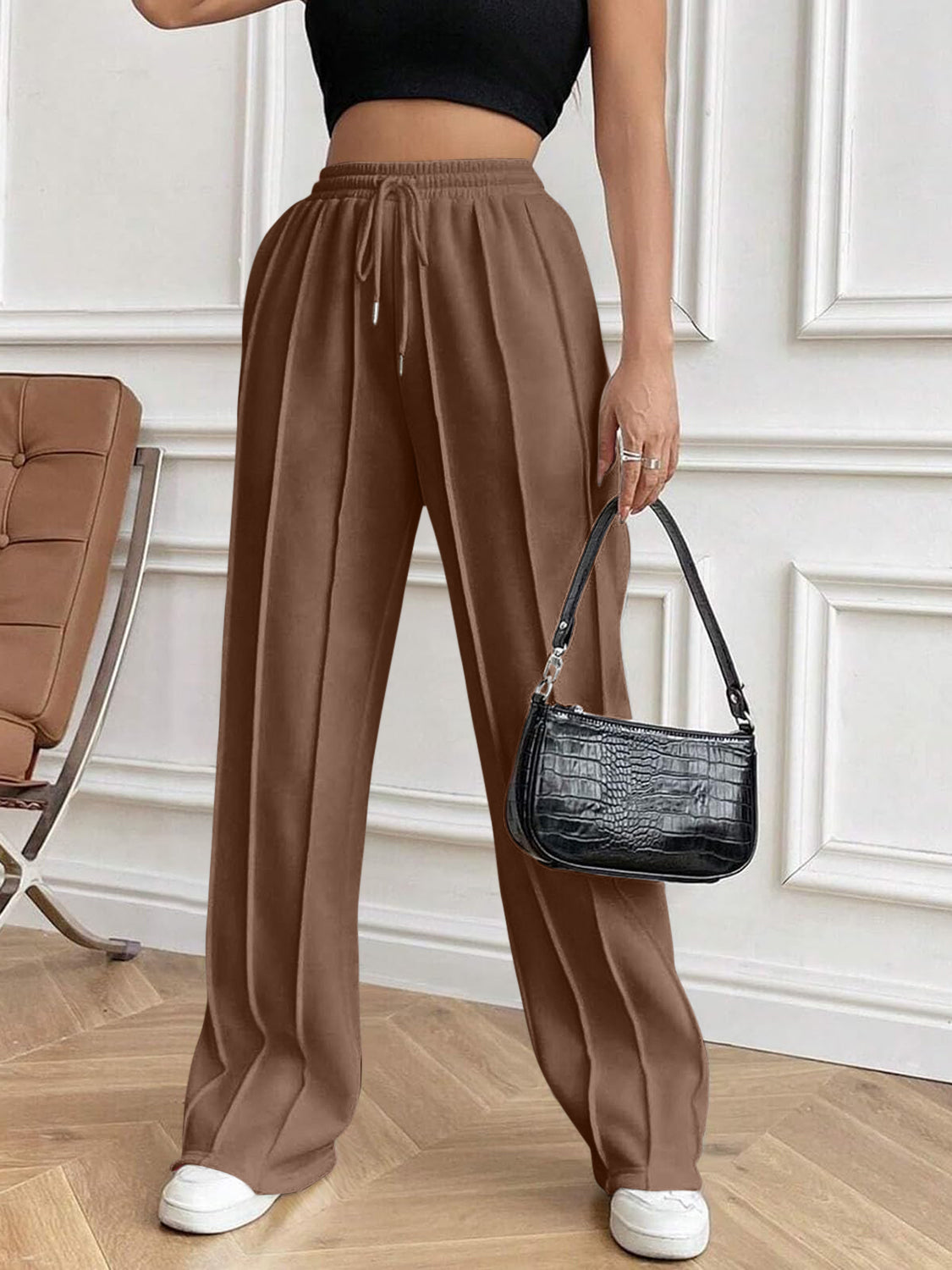 Drawstring elastic waist pants with pockets, opaque.