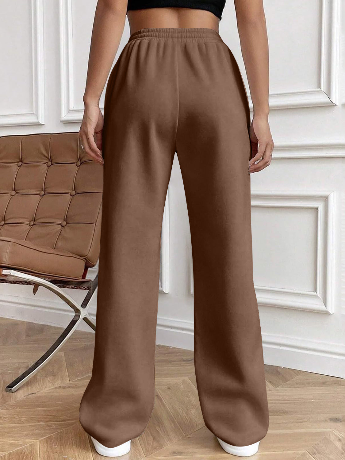 Drawstring elastic waist pants with pockets, opaque.