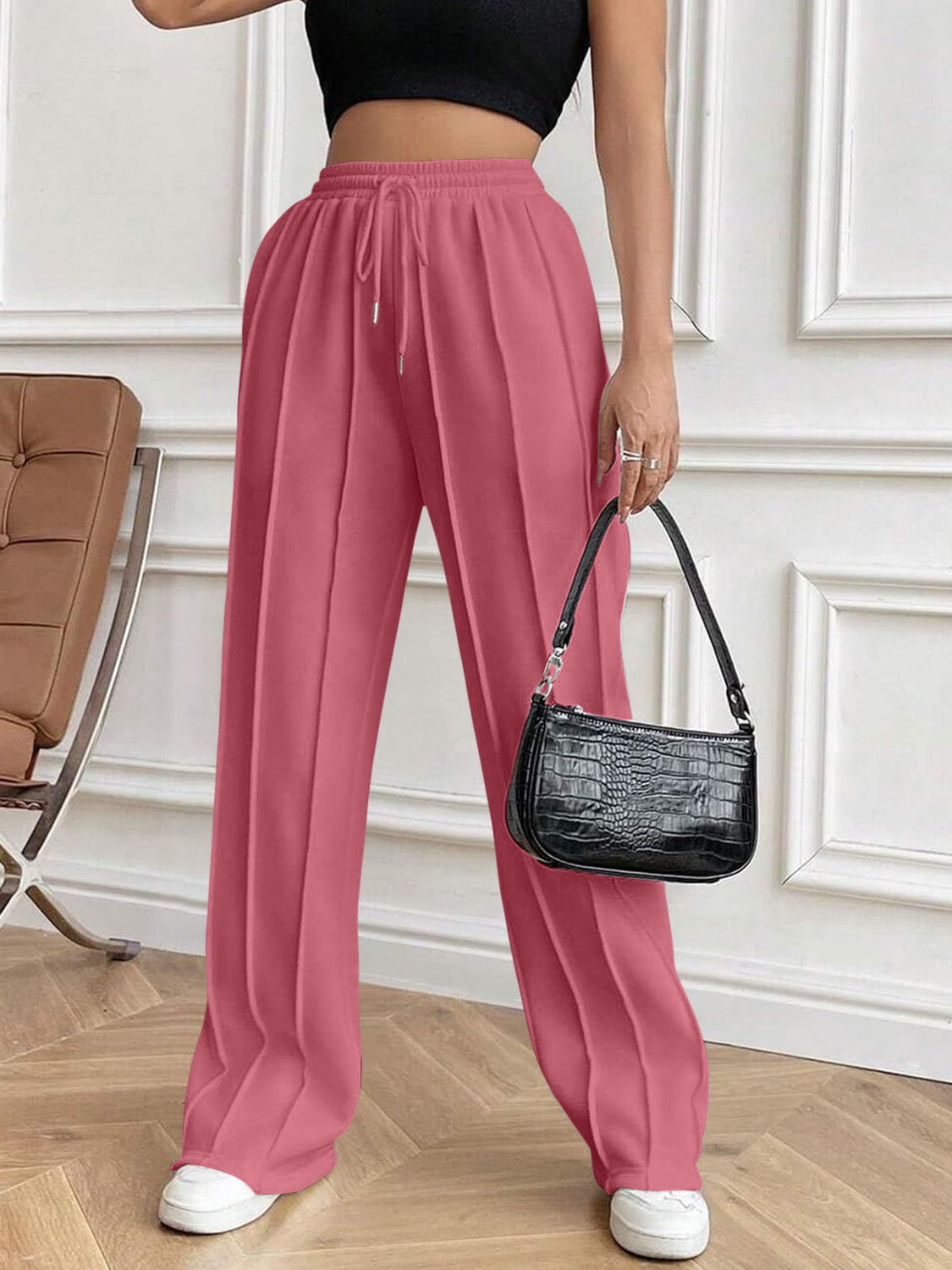 Drawstring elastic waist pants with pockets, opaque.