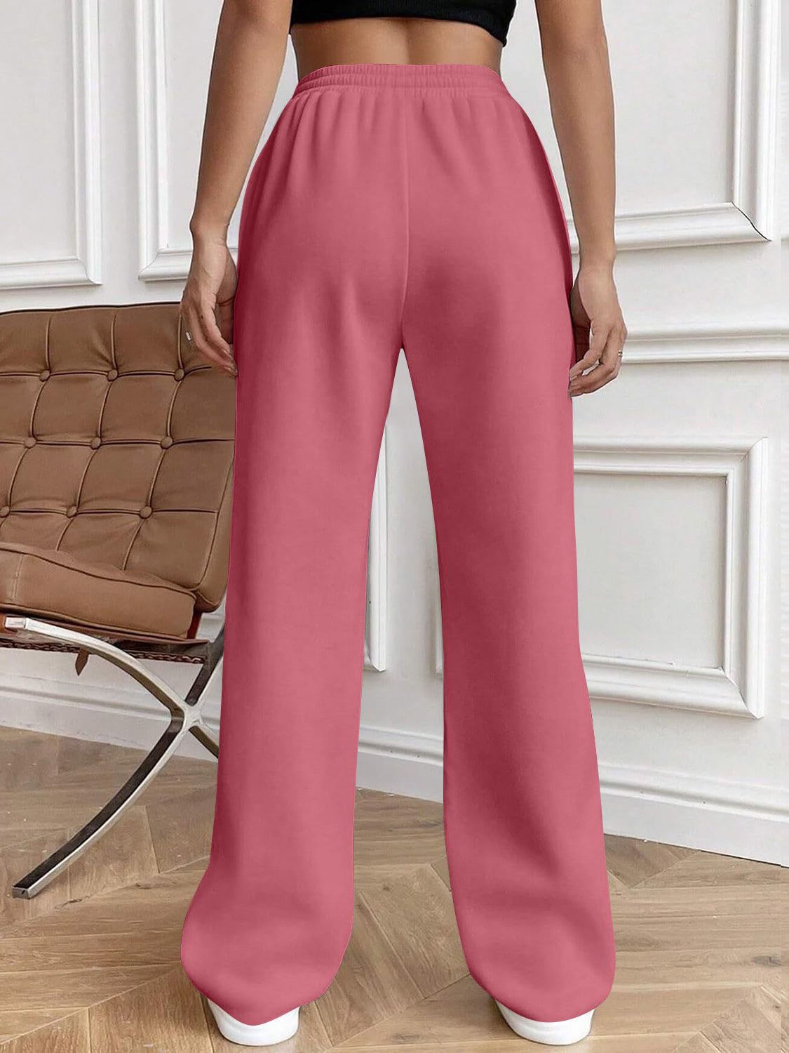 Drawstring elastic waist pants with pockets, opaque.