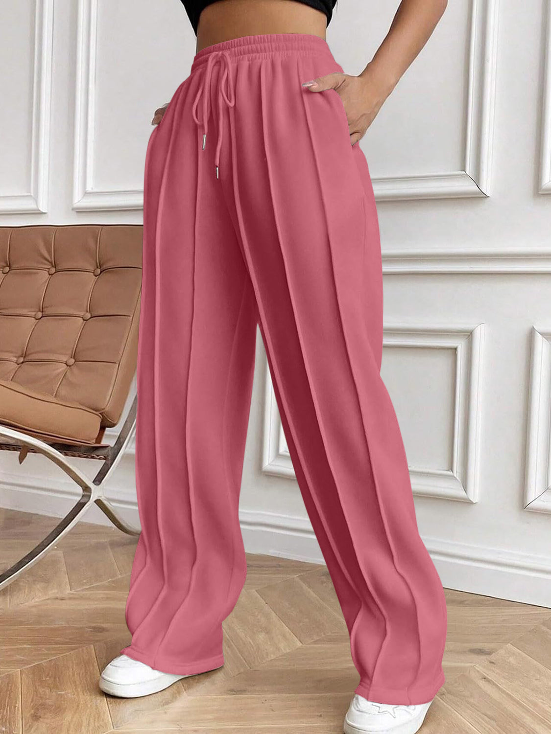 Drawstring elastic waist pants with pockets, opaque.