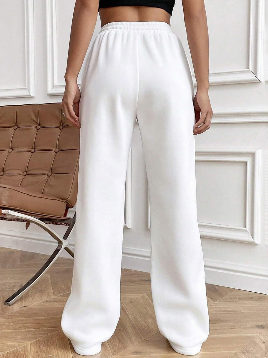 Drawstring elastic waist pants with pockets, opaque.