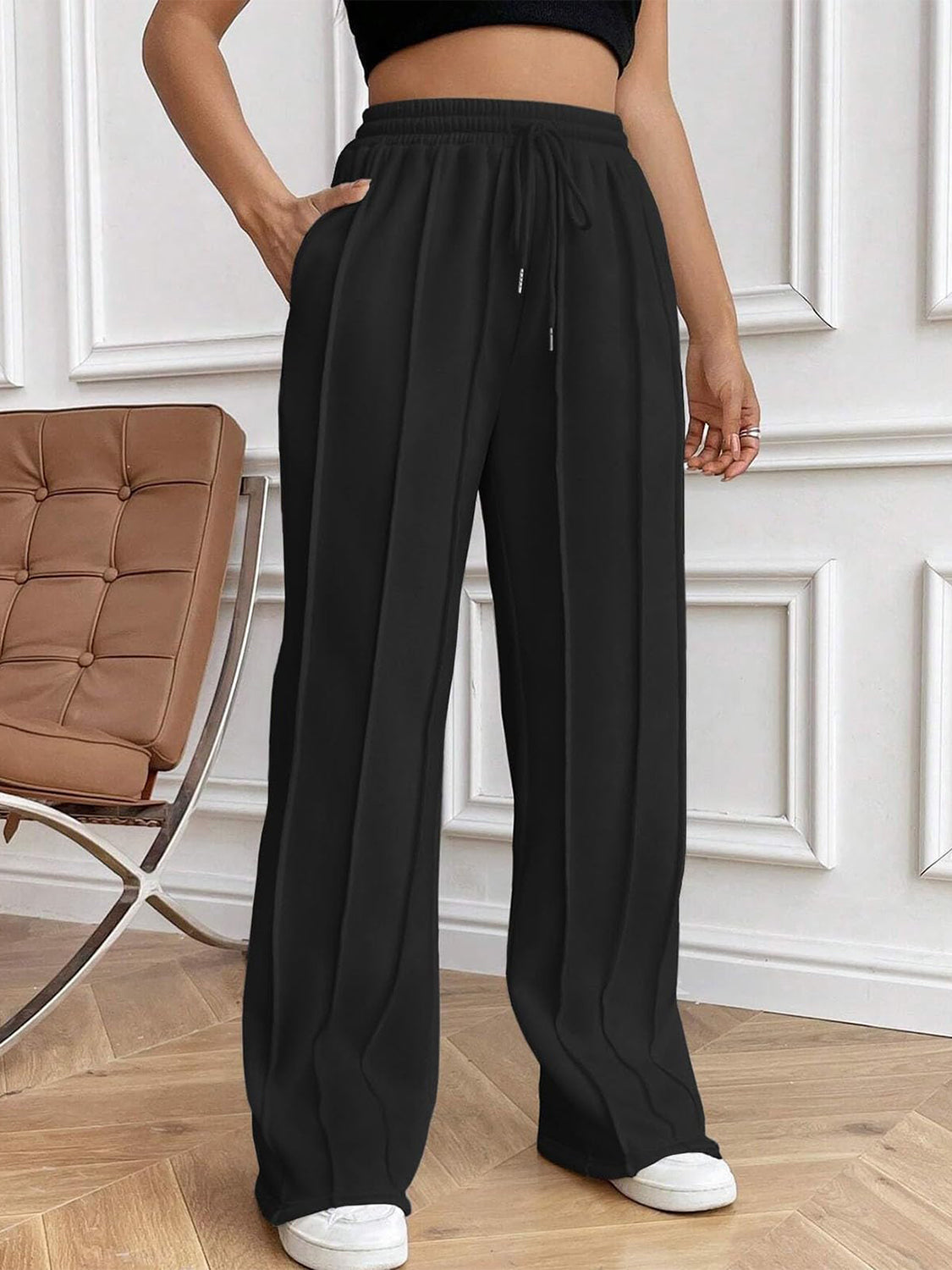Drawstring elastic waist pants with pockets, opaque.