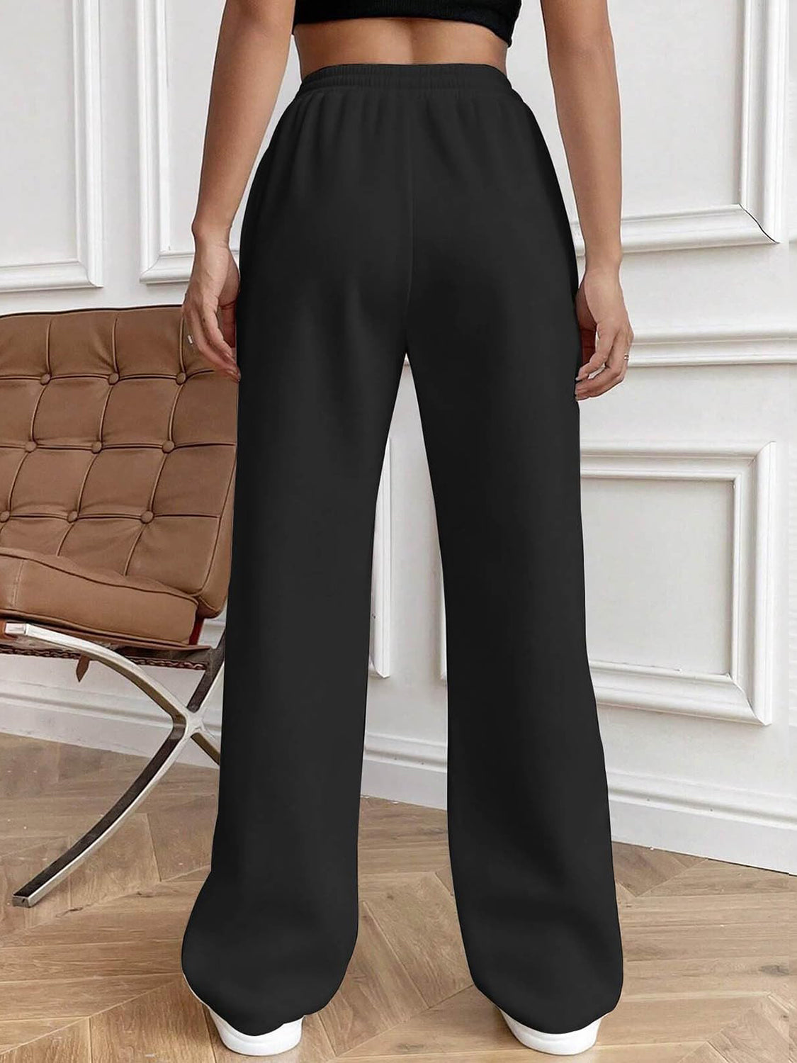 Drawstring elastic waist pants with pockets, opaque.