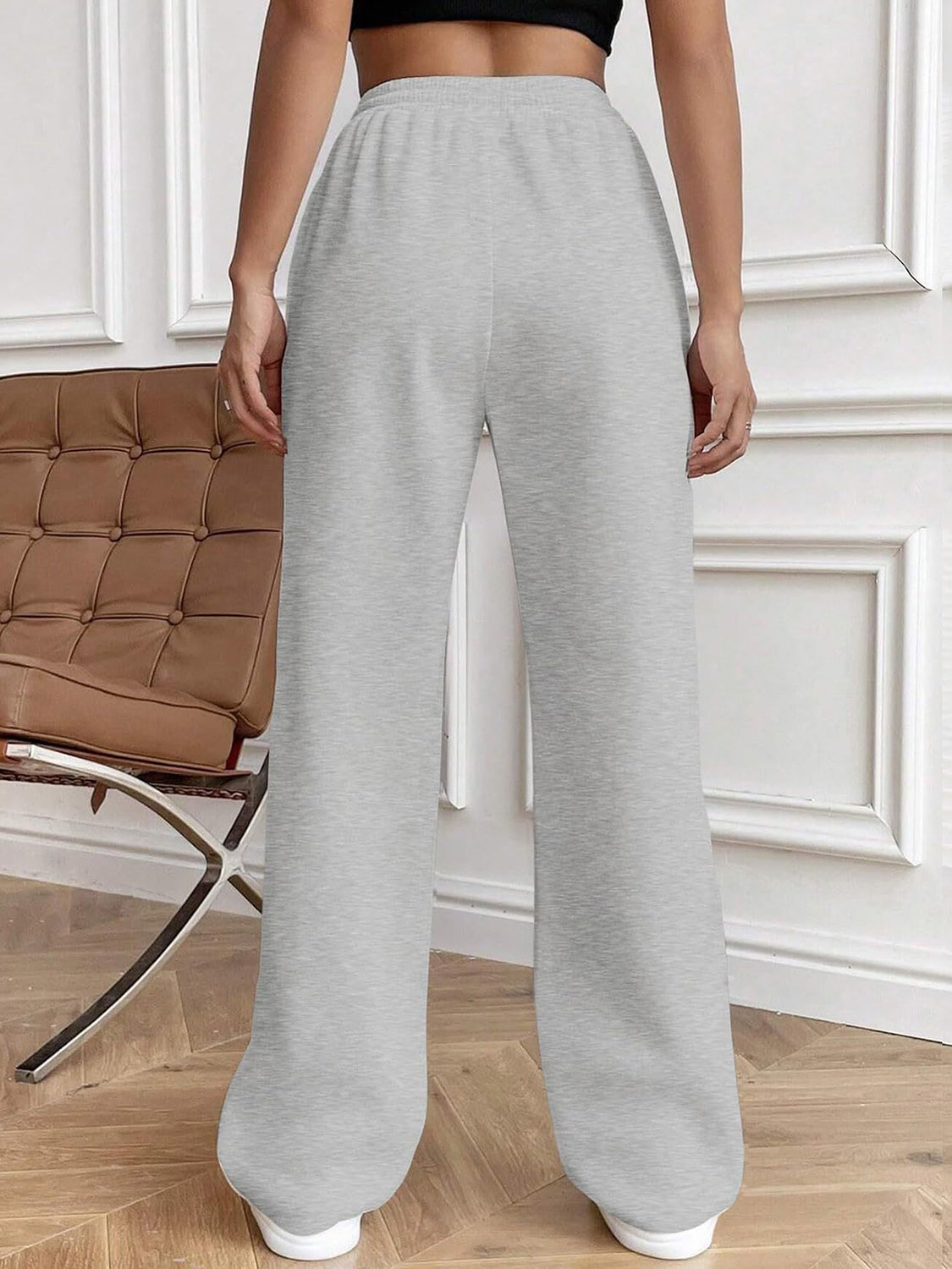 Drawstring elastic waist pants with pockets, opaque.