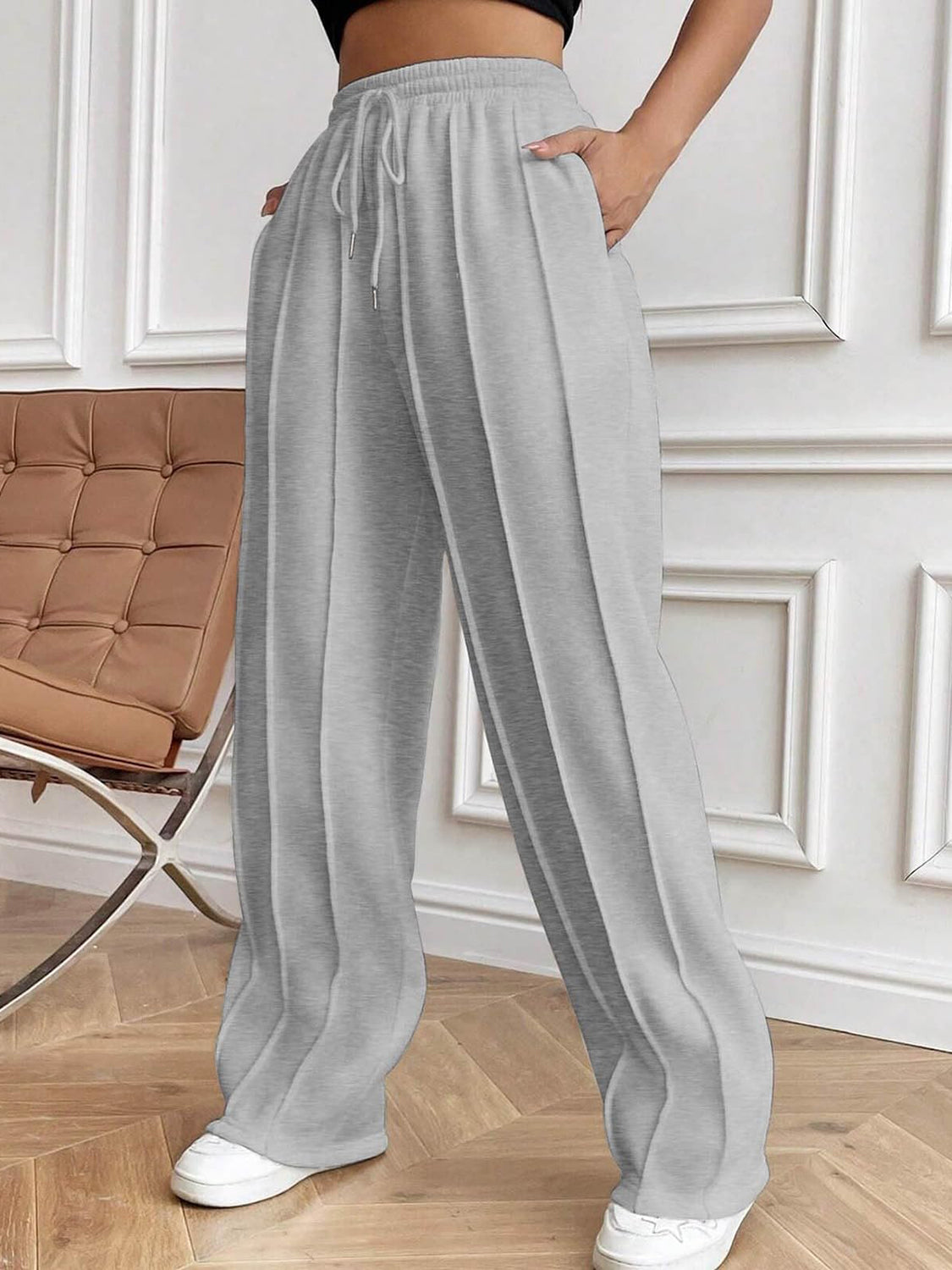Drawstring elastic waist pants with pockets, opaque.