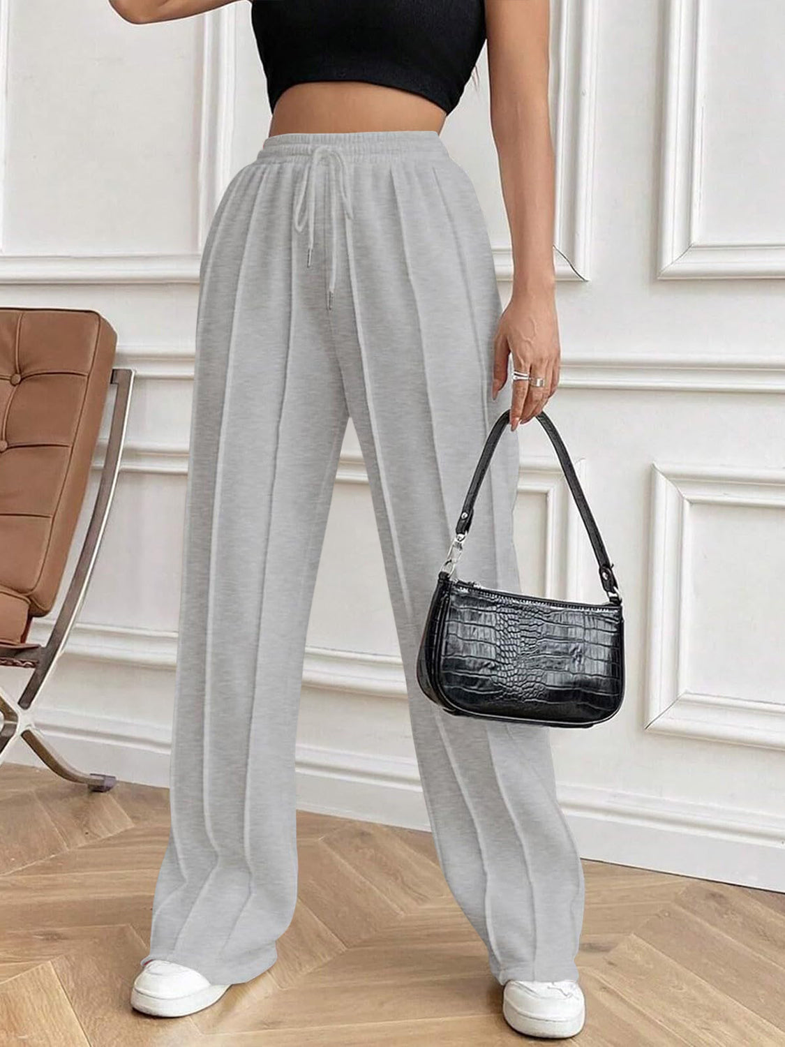 Drawstring elastic waist pants with pockets, opaque.