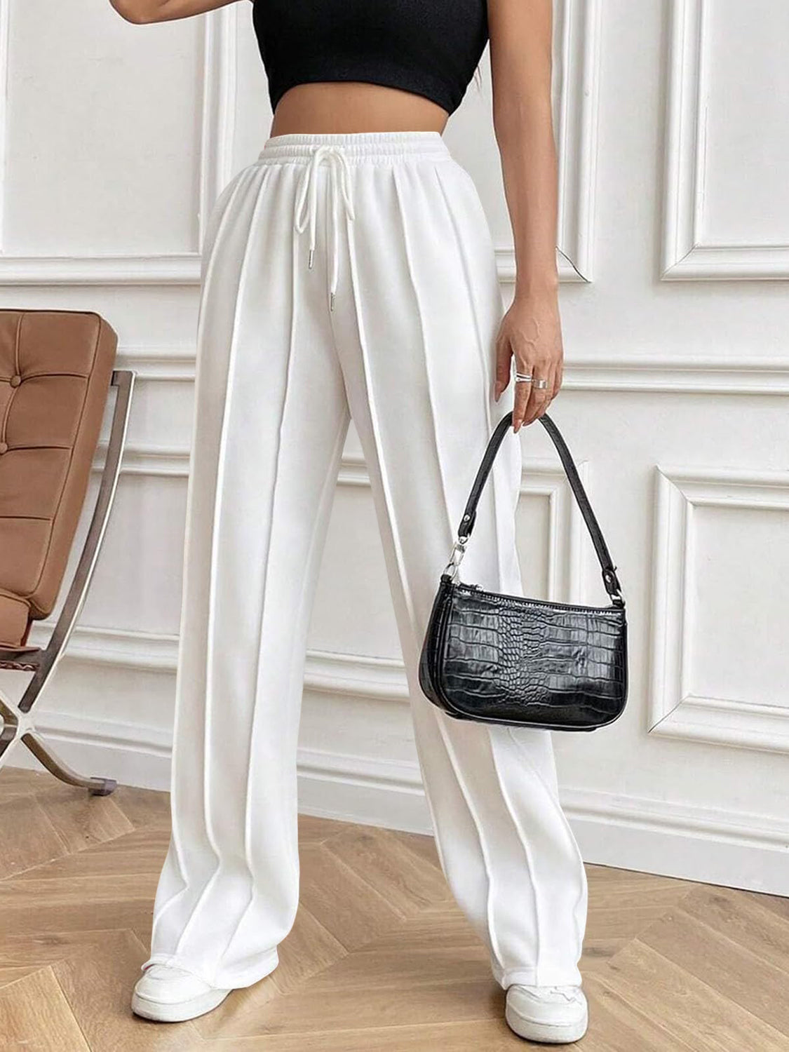 Drawstring elastic waist pants with pockets, opaque.
