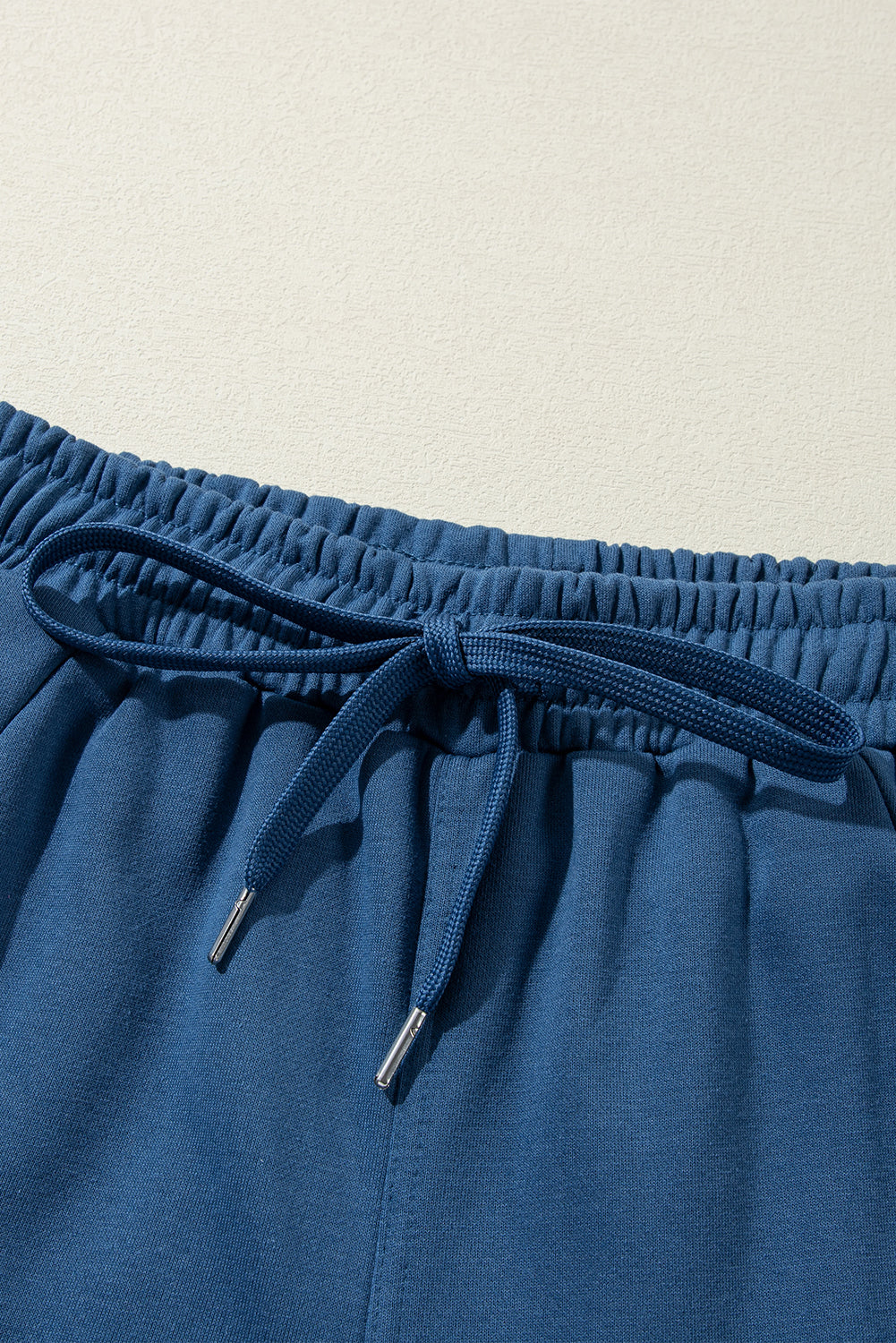 Drawstring elastic waist straight leg pants, opaque.