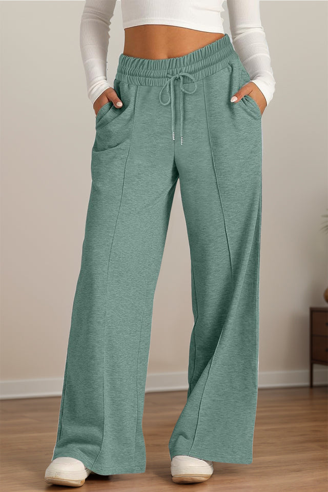 Drawstring elastic waist wide leg pants with pockets, opaque.