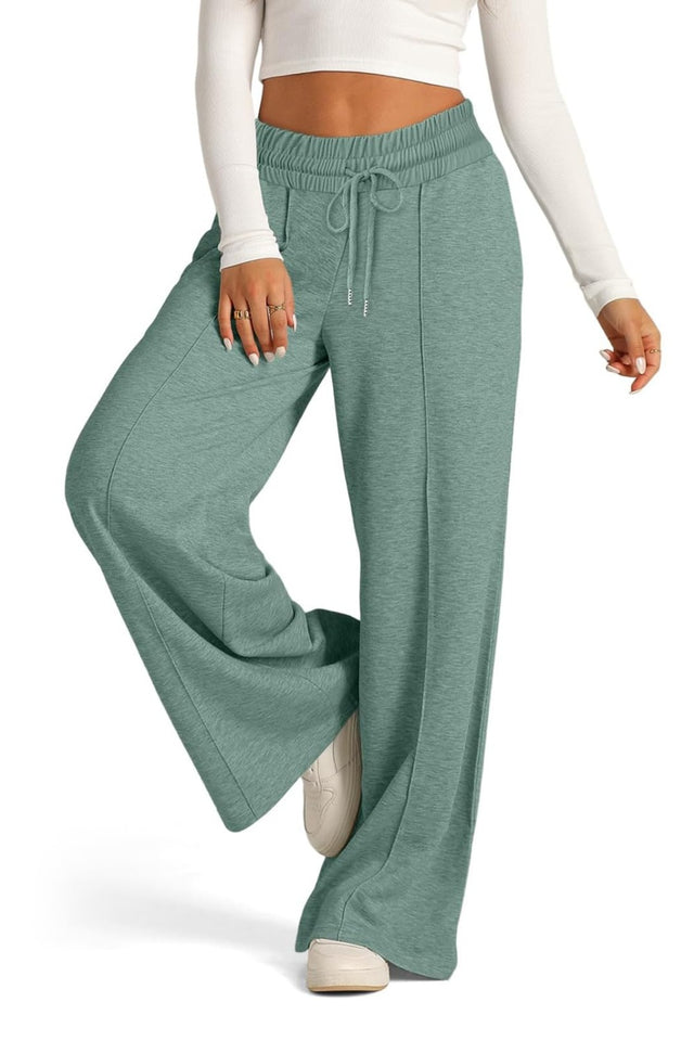 Drawstring elastic waist wide leg pants with pockets, opaque.