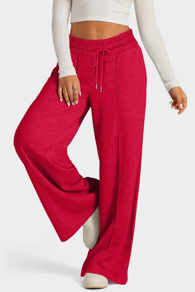 Drawstring elastic waist wide leg pants with pockets, opaque.