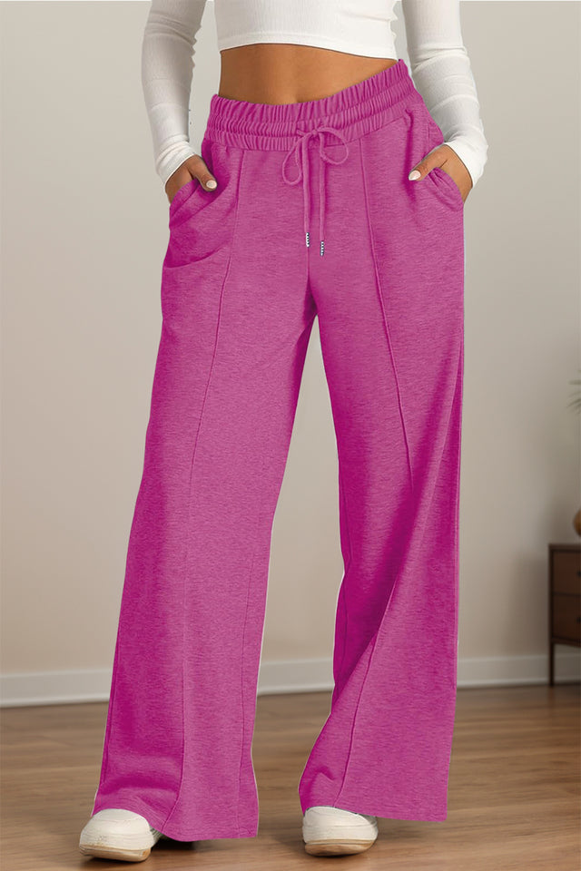 Drawstring elastic waist wide leg pants with pockets, opaque.
