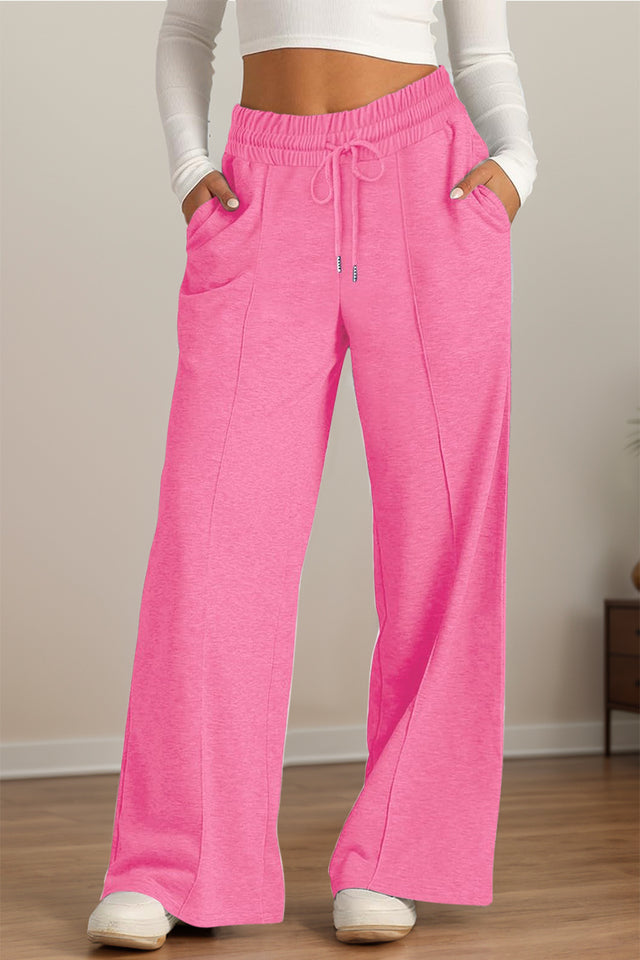 Drawstring elastic waist wide leg pants with pockets, opaque.