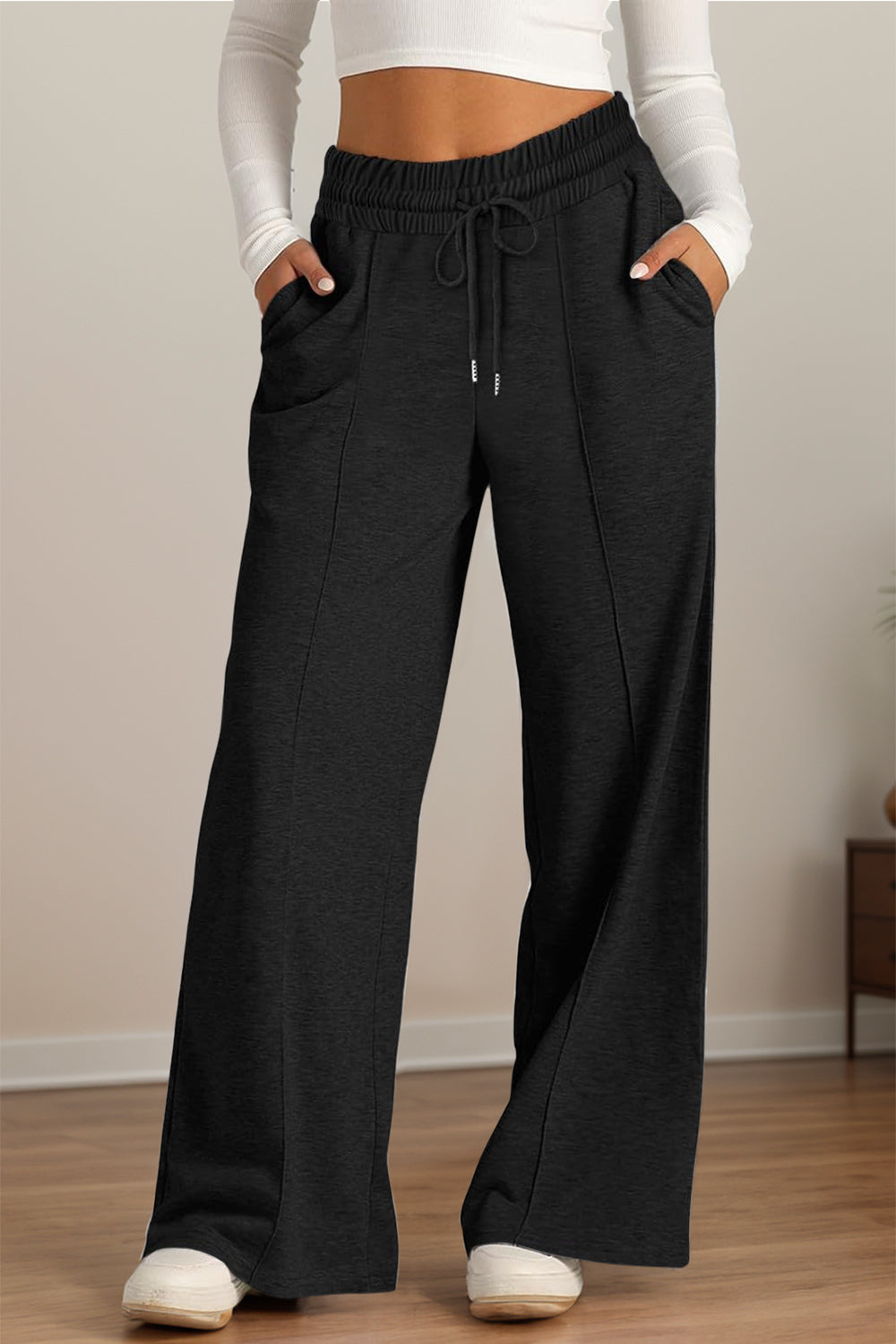 Drawstring elastic waist wide leg pants with pockets, opaque.