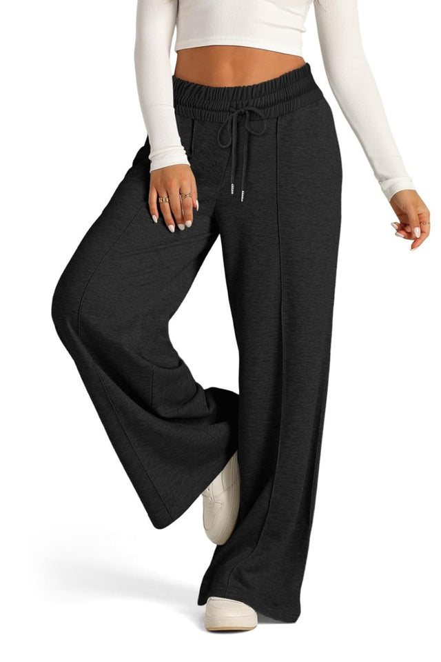 Drawstring elastic waist wide leg pants with pockets, opaque.