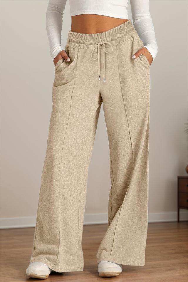 Drawstring elastic waist wide leg pants with pockets, opaque.