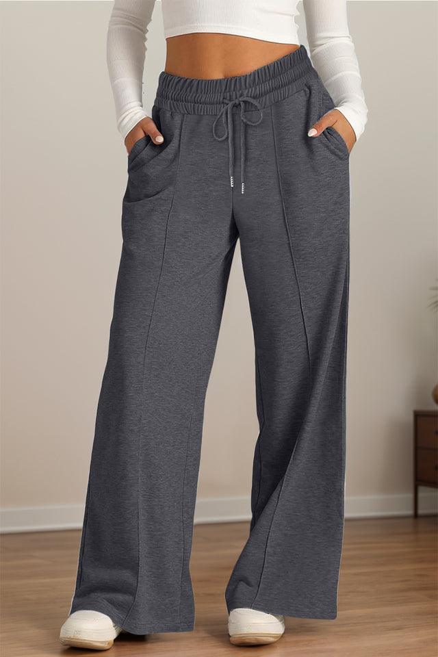 Drawstring elastic waist wide leg pants with pockets, opaque.