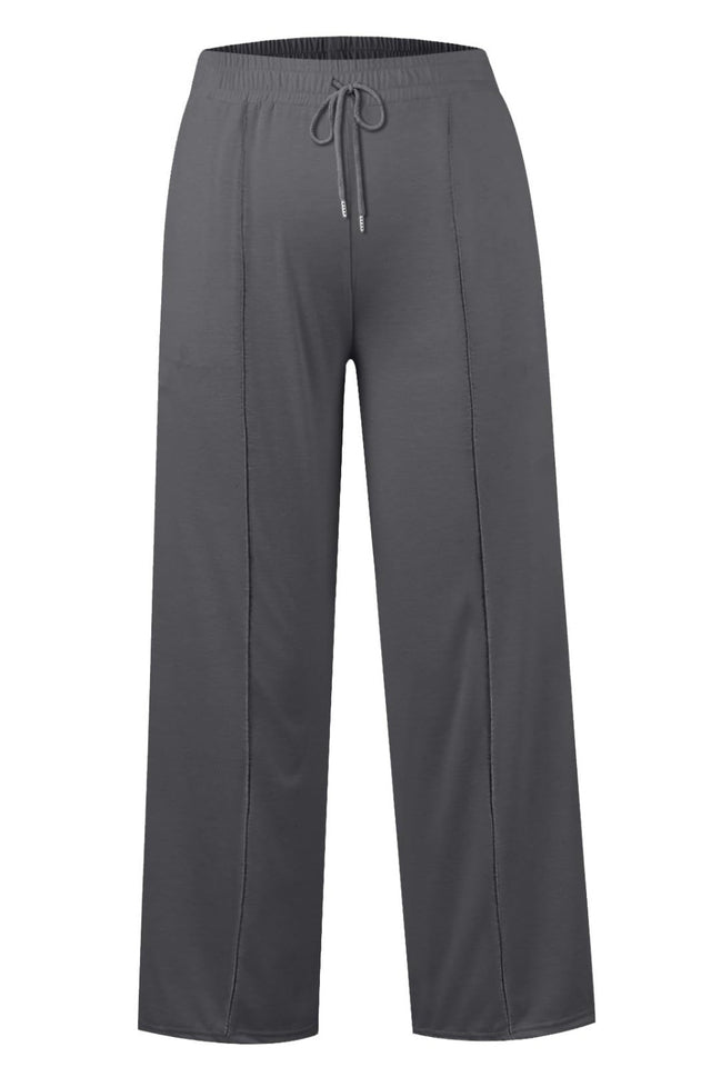 Drawstring elastic waist wide leg pants with pockets, opaque.