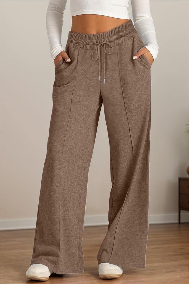 Drawstring elastic waist wide leg pants with pockets, opaque.