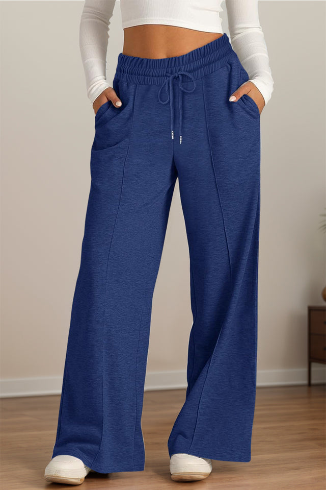 Drawstring elastic waist wide leg pants with pockets, opaque.