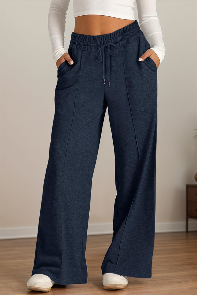Drawstring elastic waist wide leg pants with pockets, opaque.