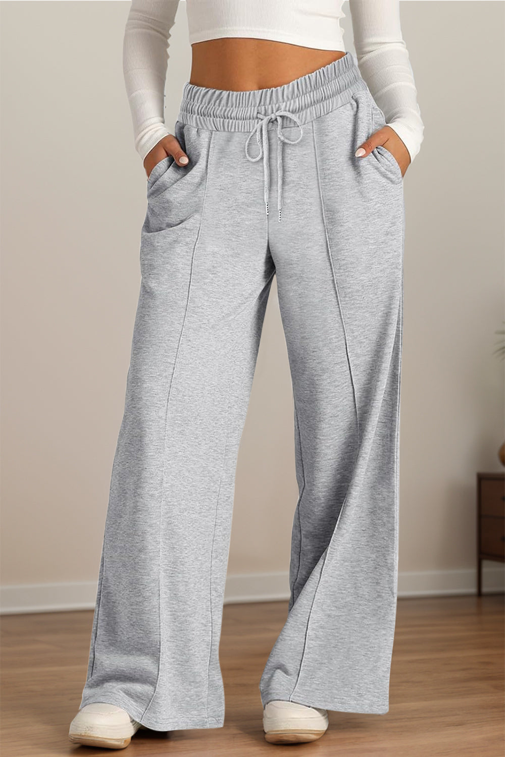 Drawstring elastic waist wide leg pants with pockets, opaque.