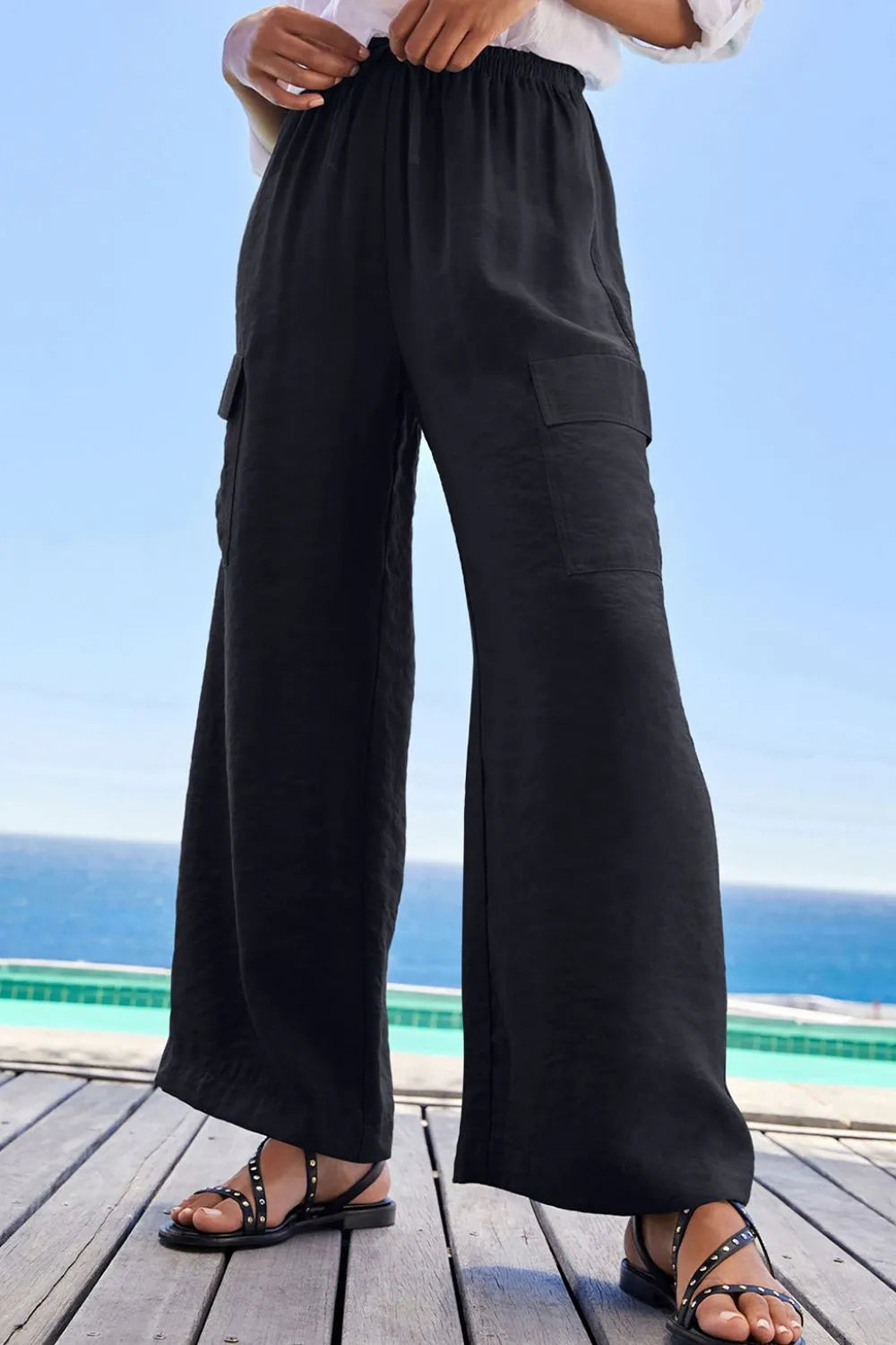 Drawstring frilled waist wide leg utility trousers with pockets.