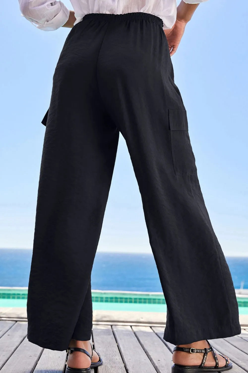 Drawstring frilled waist wide leg utility trousers with pockets.