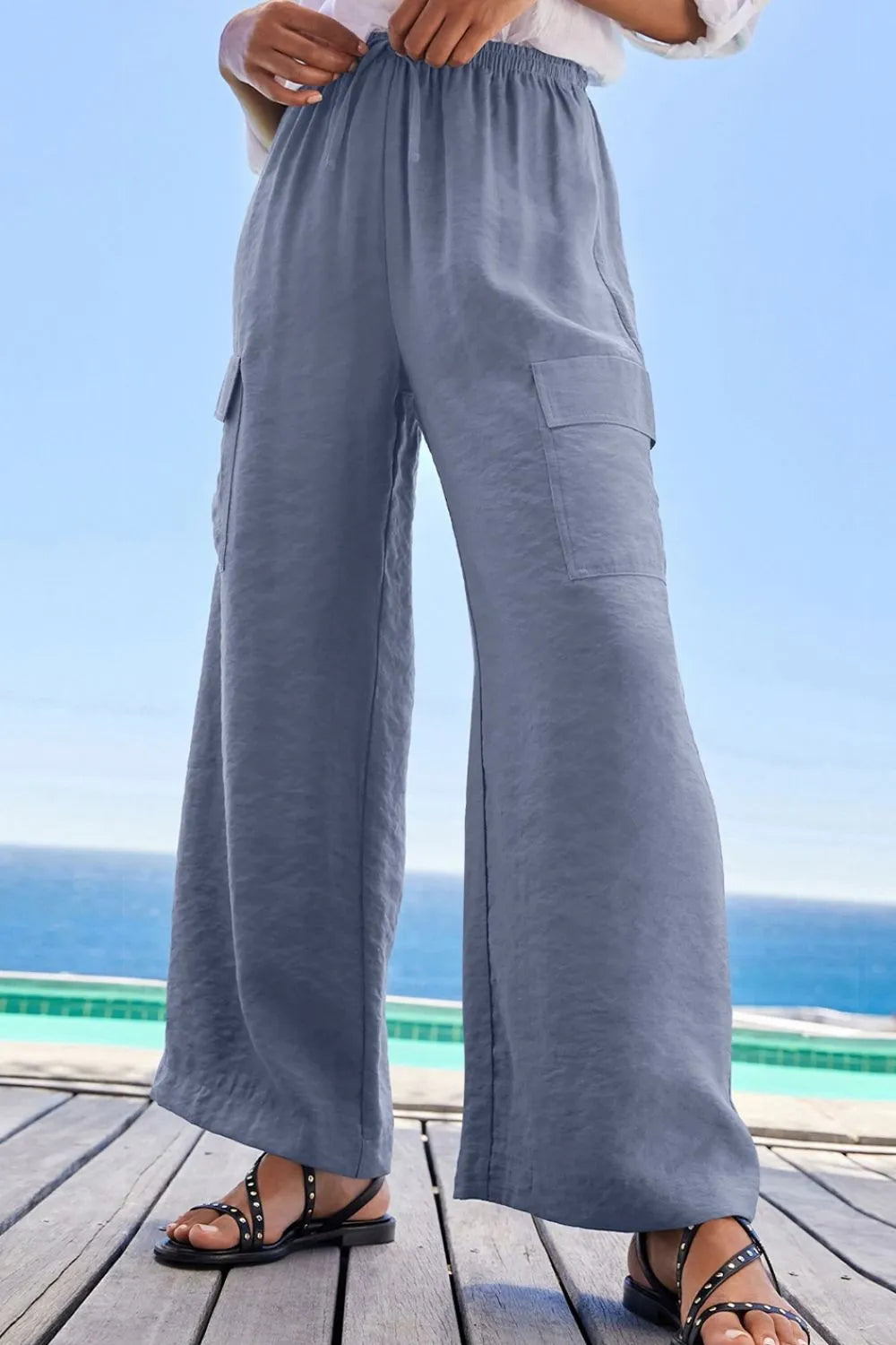 Drawstring frilled waist wide leg utility trousers with pockets.