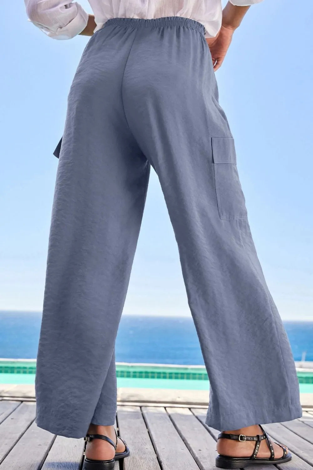 Drawstring frilled waist wide leg utility trousers with pockets.