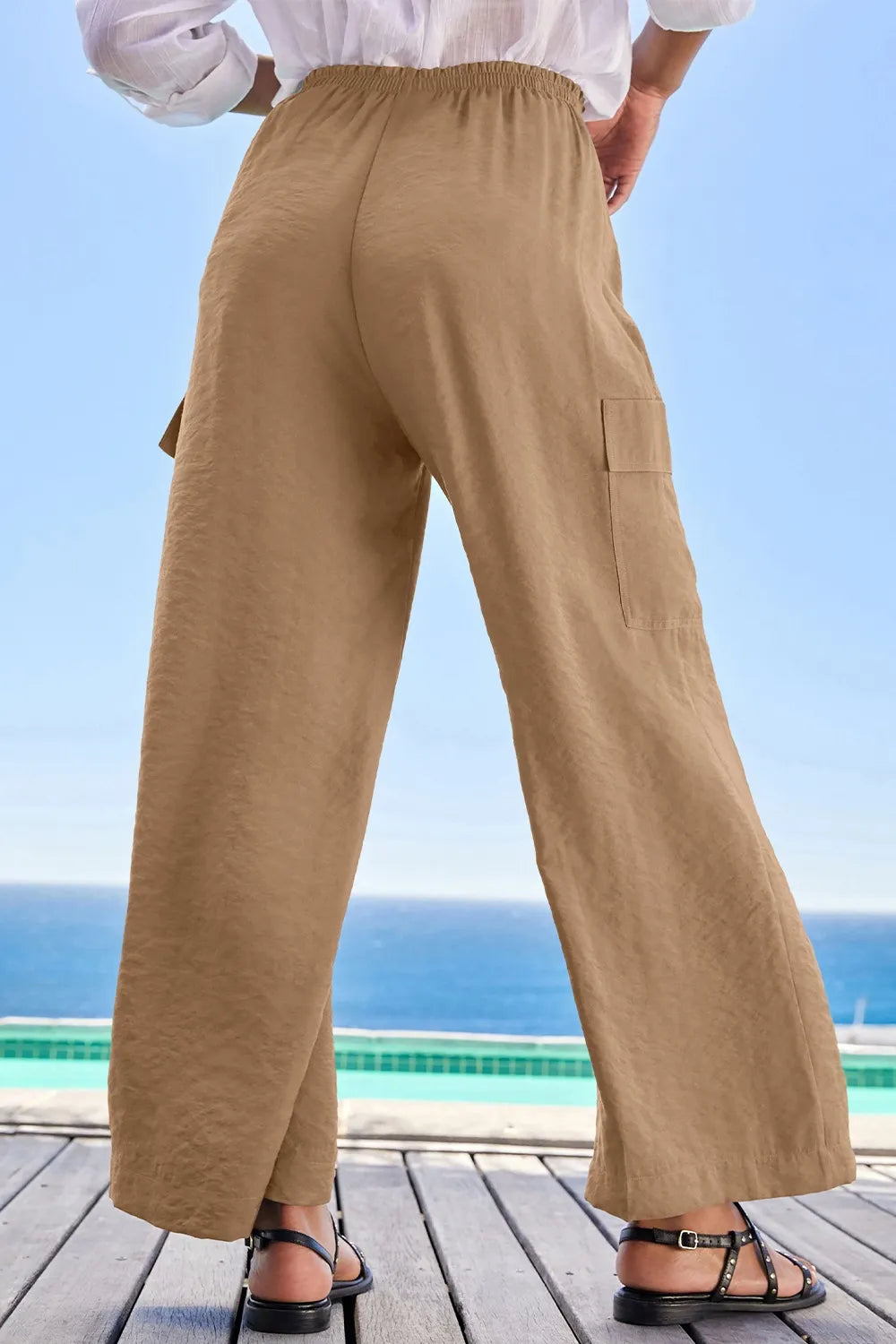 Drawstring frilled waist wide leg utility trousers with pockets.