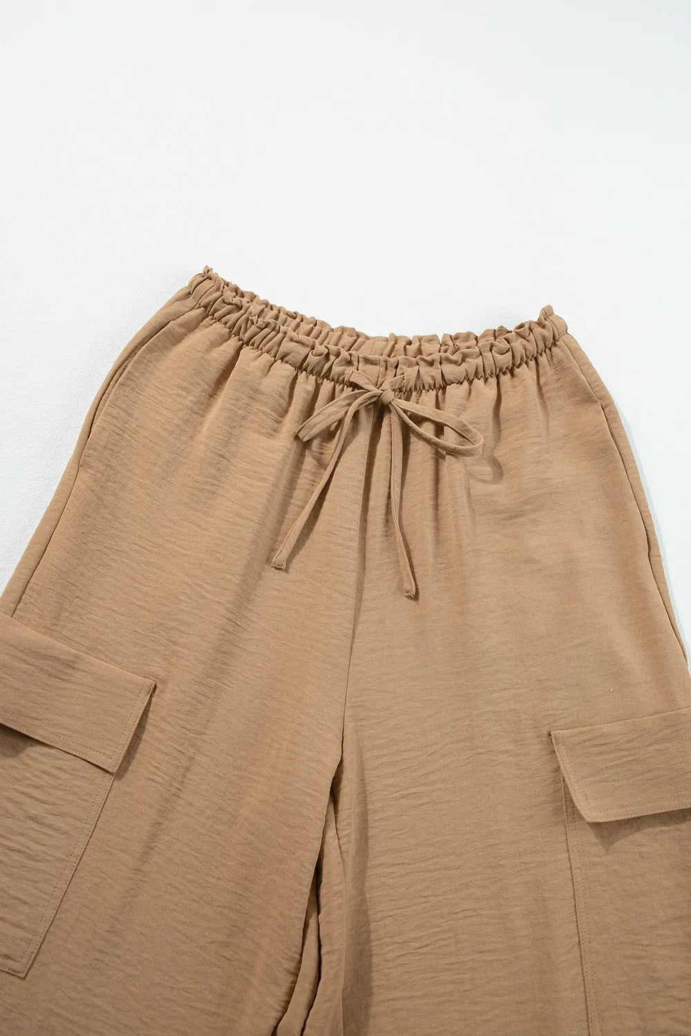 Drawstring frilled waist wide leg utility trousers with pockets.