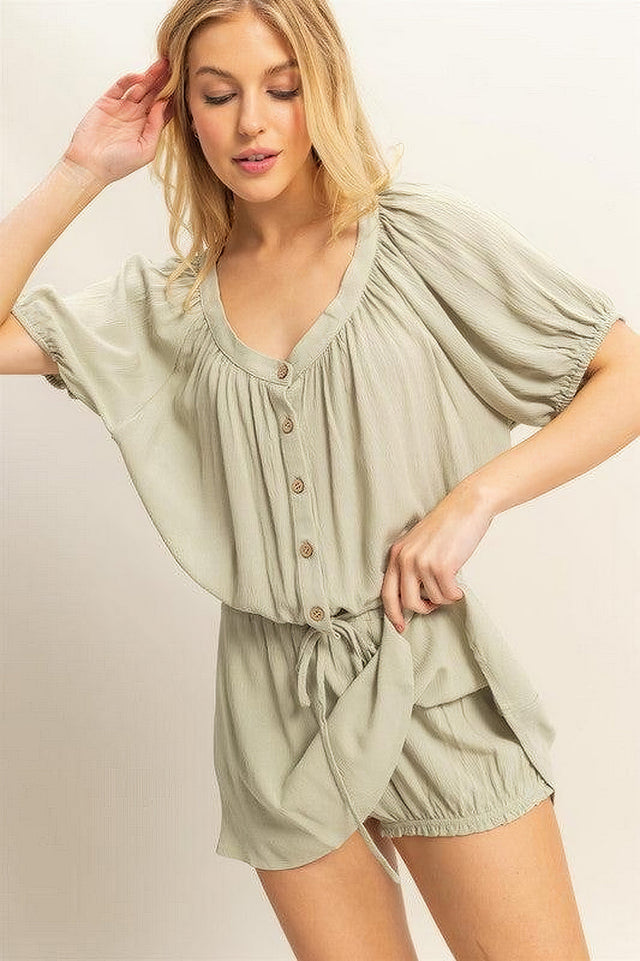Women's short sleeve top and skort set with drawstring hem and button details