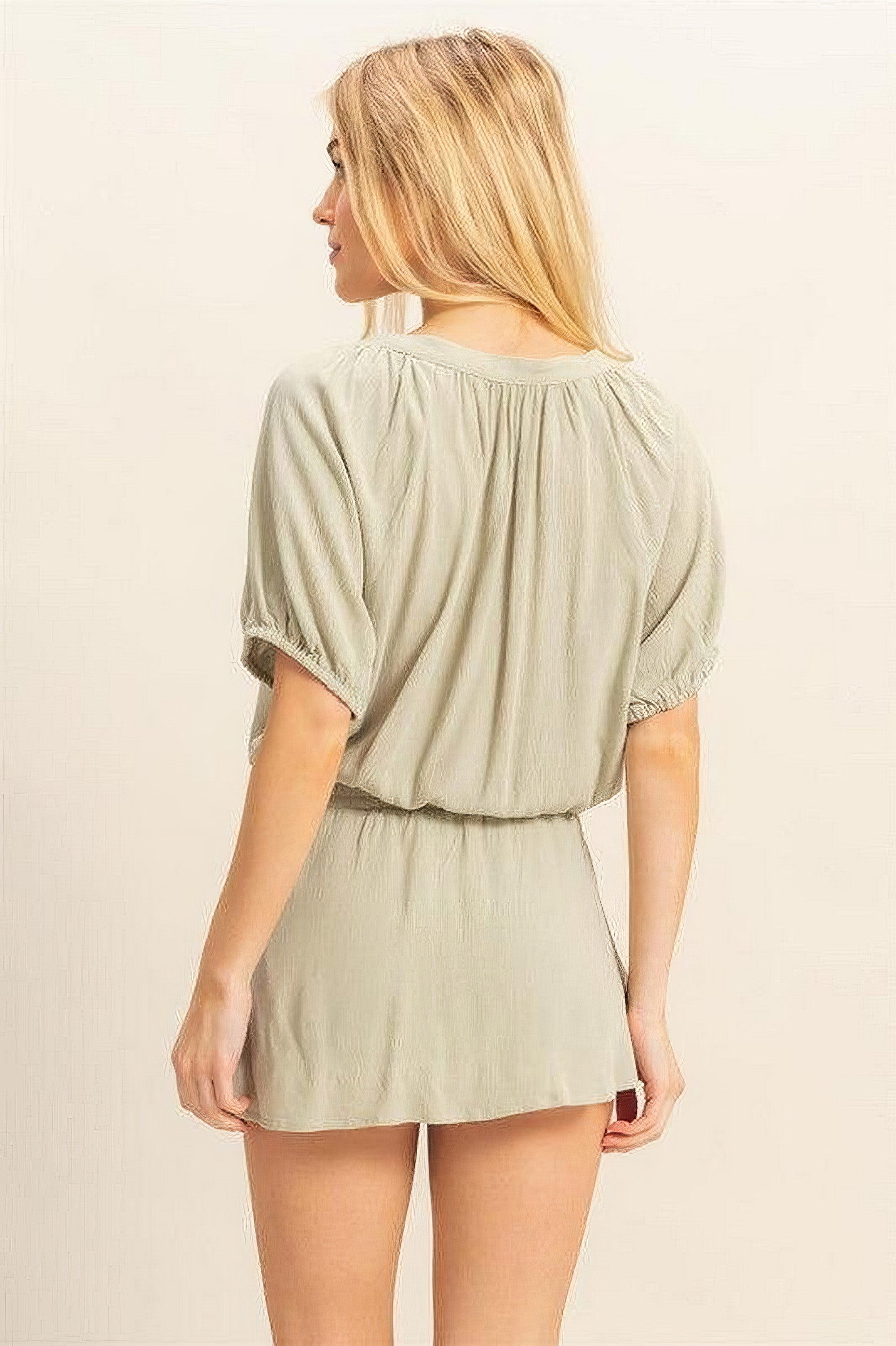 Women's short sleeve top and skort set with drawstring hem and button details