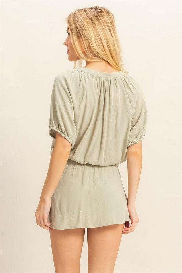 Women's short sleeve top and skort set with drawstring hem and button details
