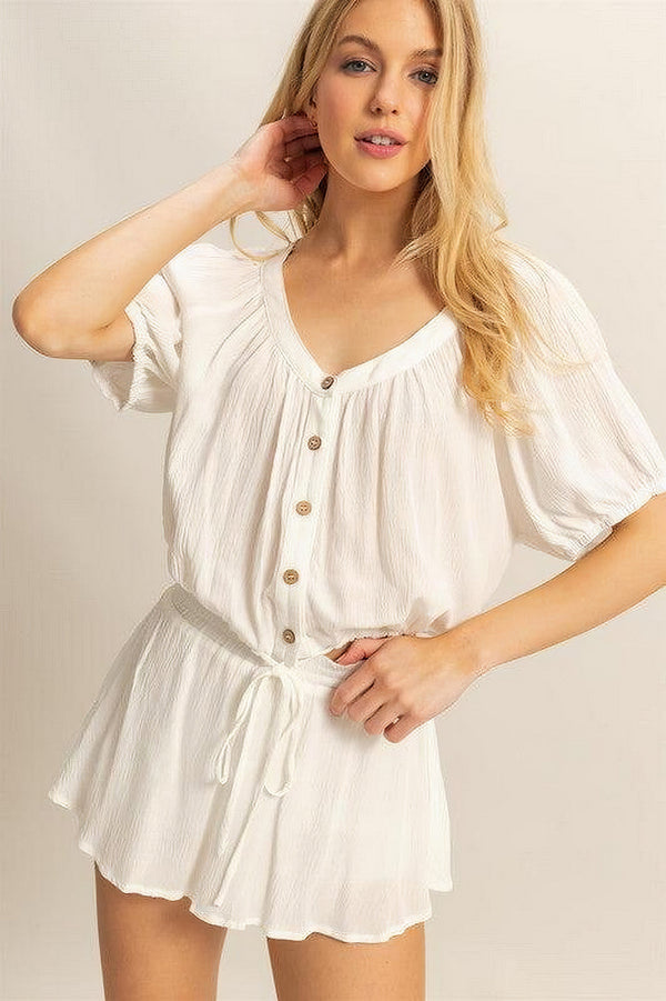 Women's short sleeve top and skort set with drawstring hem and button details
