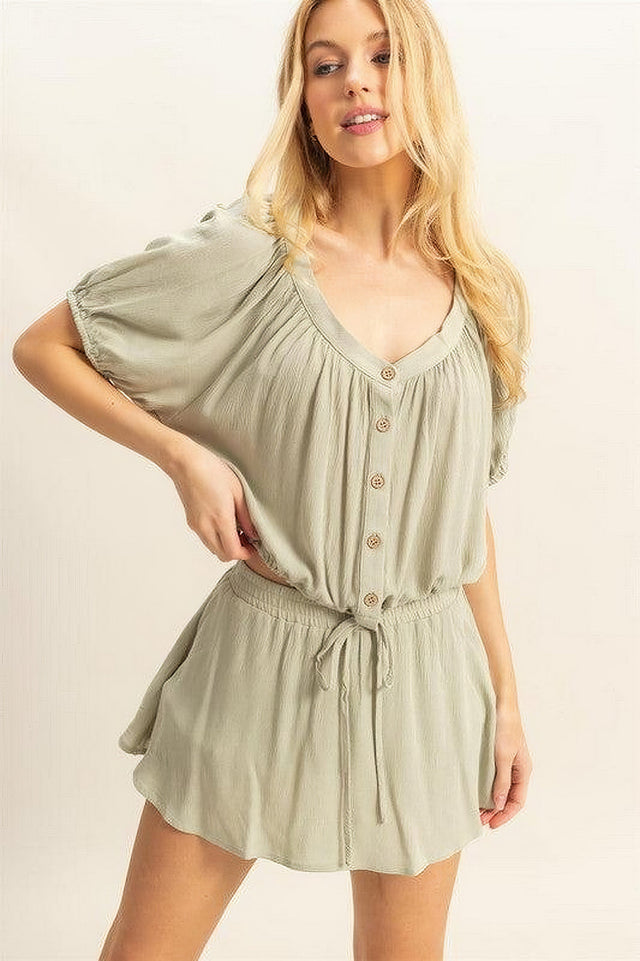 Women's short sleeve top and skort set with drawstring hem and button details