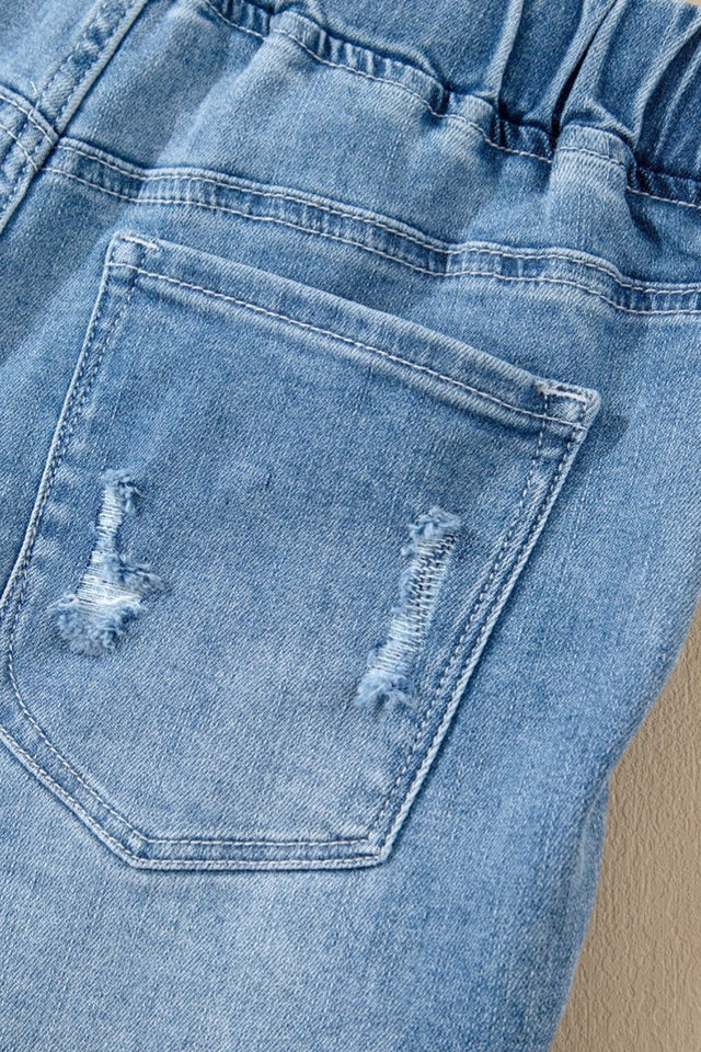 Drawstring high-waist distressed denim shorts with pockets.