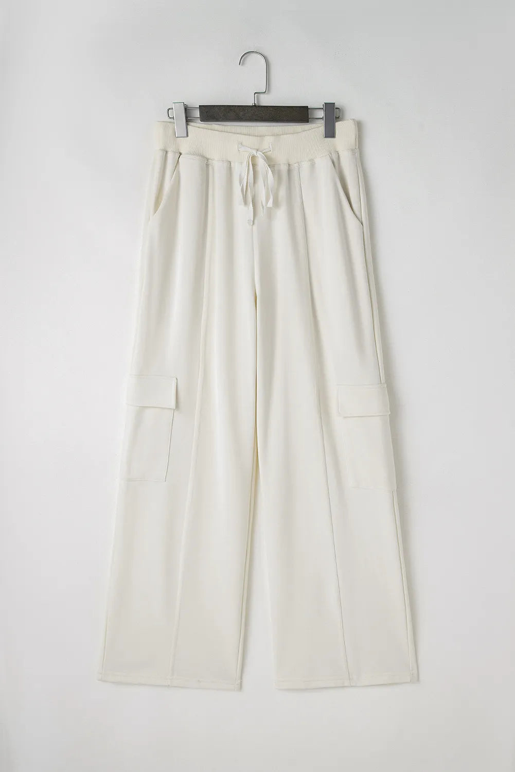 Drawstring high waist pants with pockets, opaque.