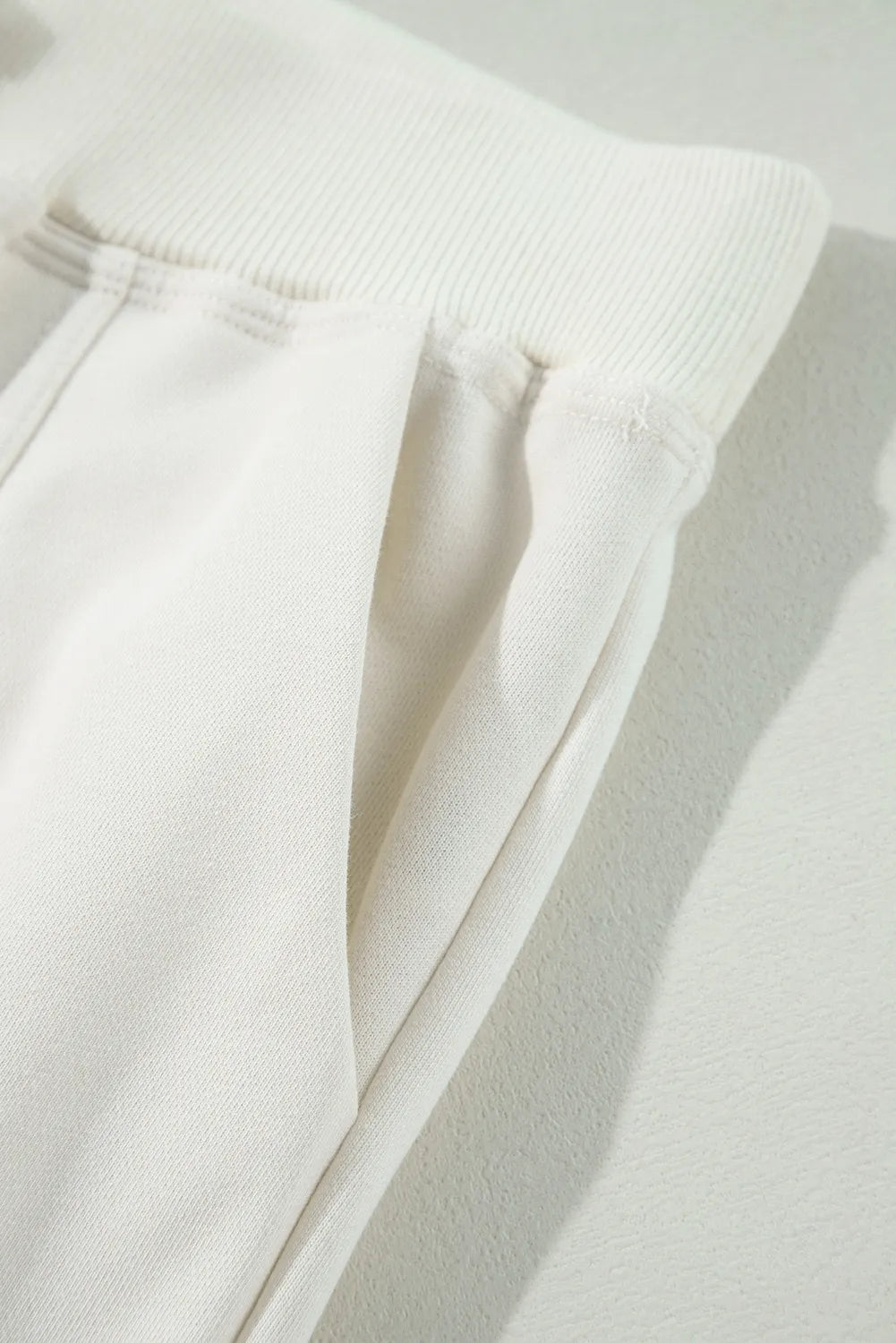 Drawstring high waist pants with pockets, opaque.