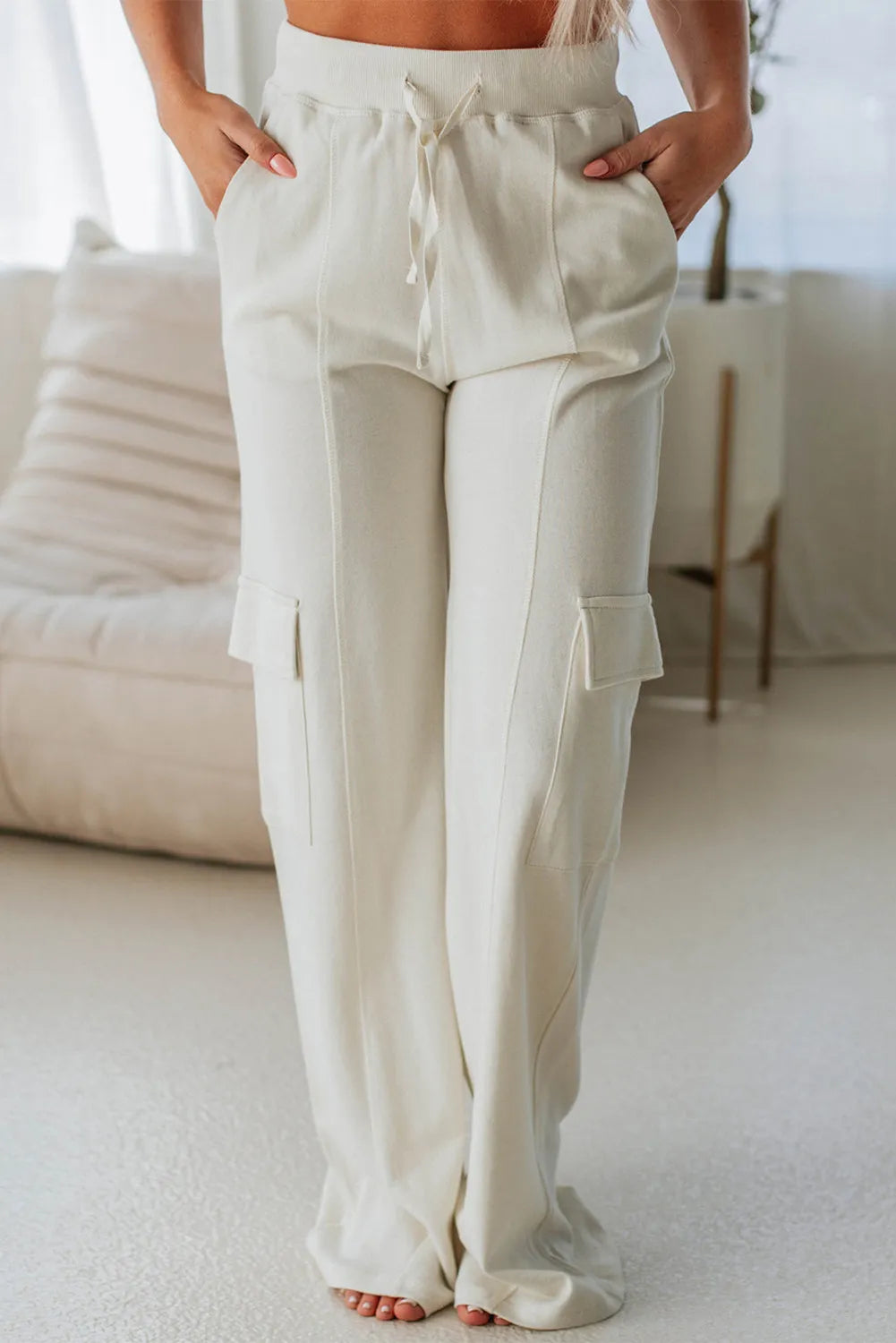 Drawstring high waist pants with pockets, opaque.