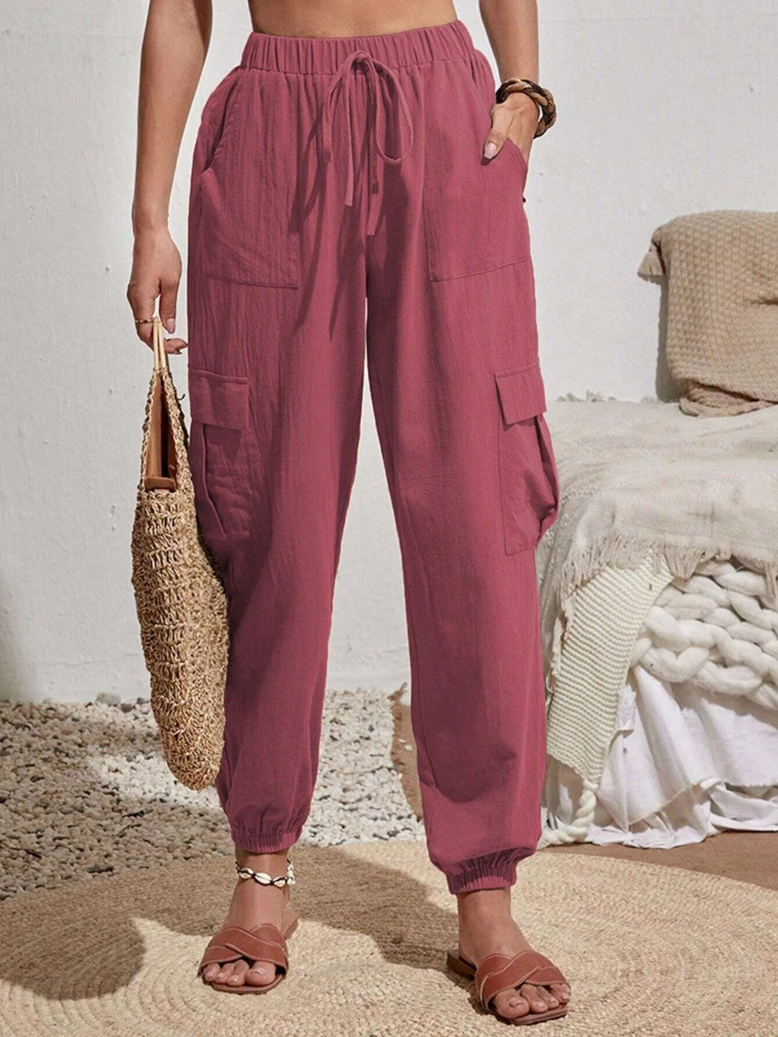 Drawstring joggers with cargo pockets, opaque.