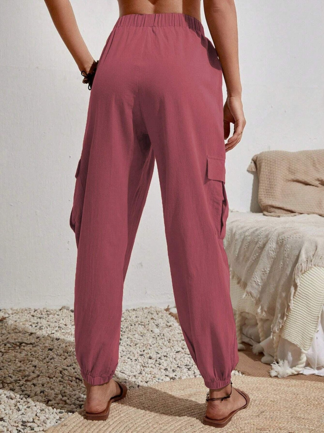 Drawstring joggers with cargo pockets, opaque.
