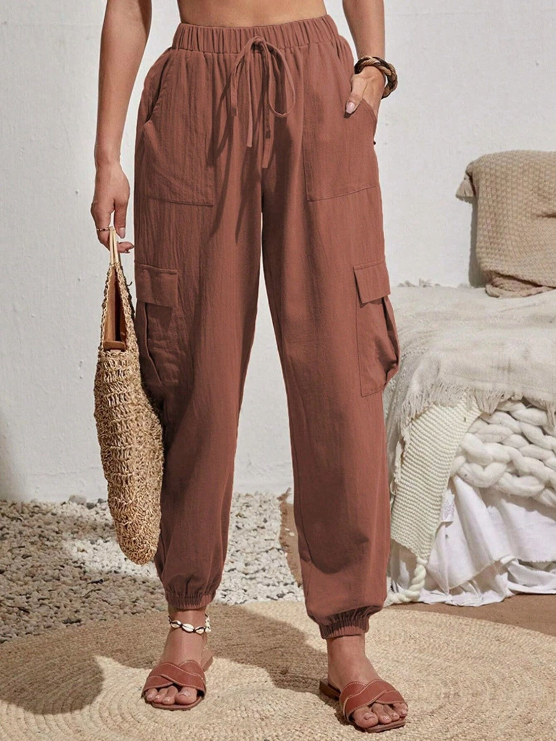 Drawstring joggers with cargo pockets, opaque.