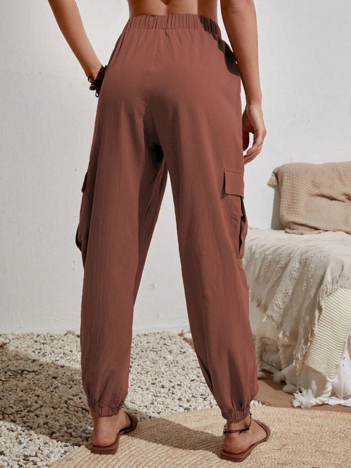 Drawstring joggers with cargo pockets, opaque.