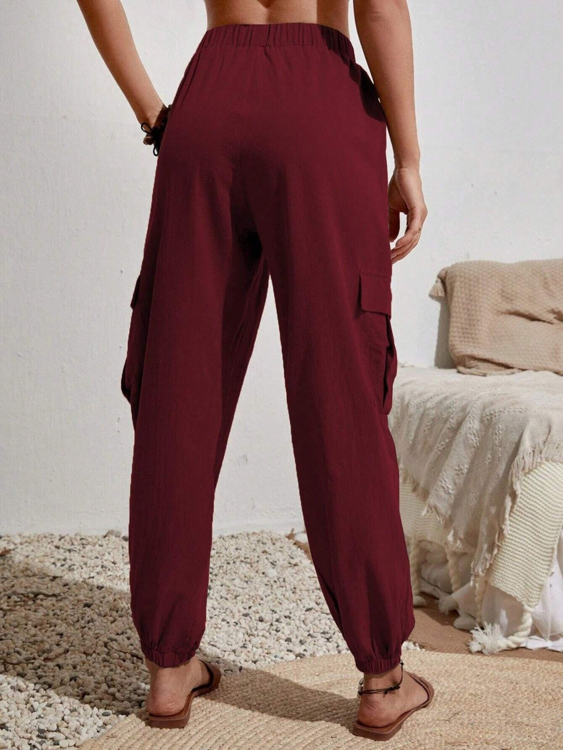 Drawstring joggers with cargo pockets, opaque.