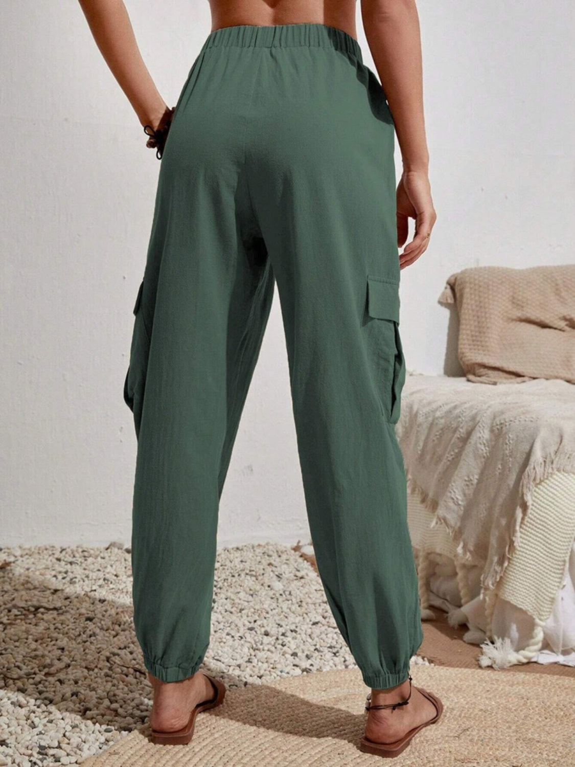 Drawstring joggers with cargo pockets, opaque.