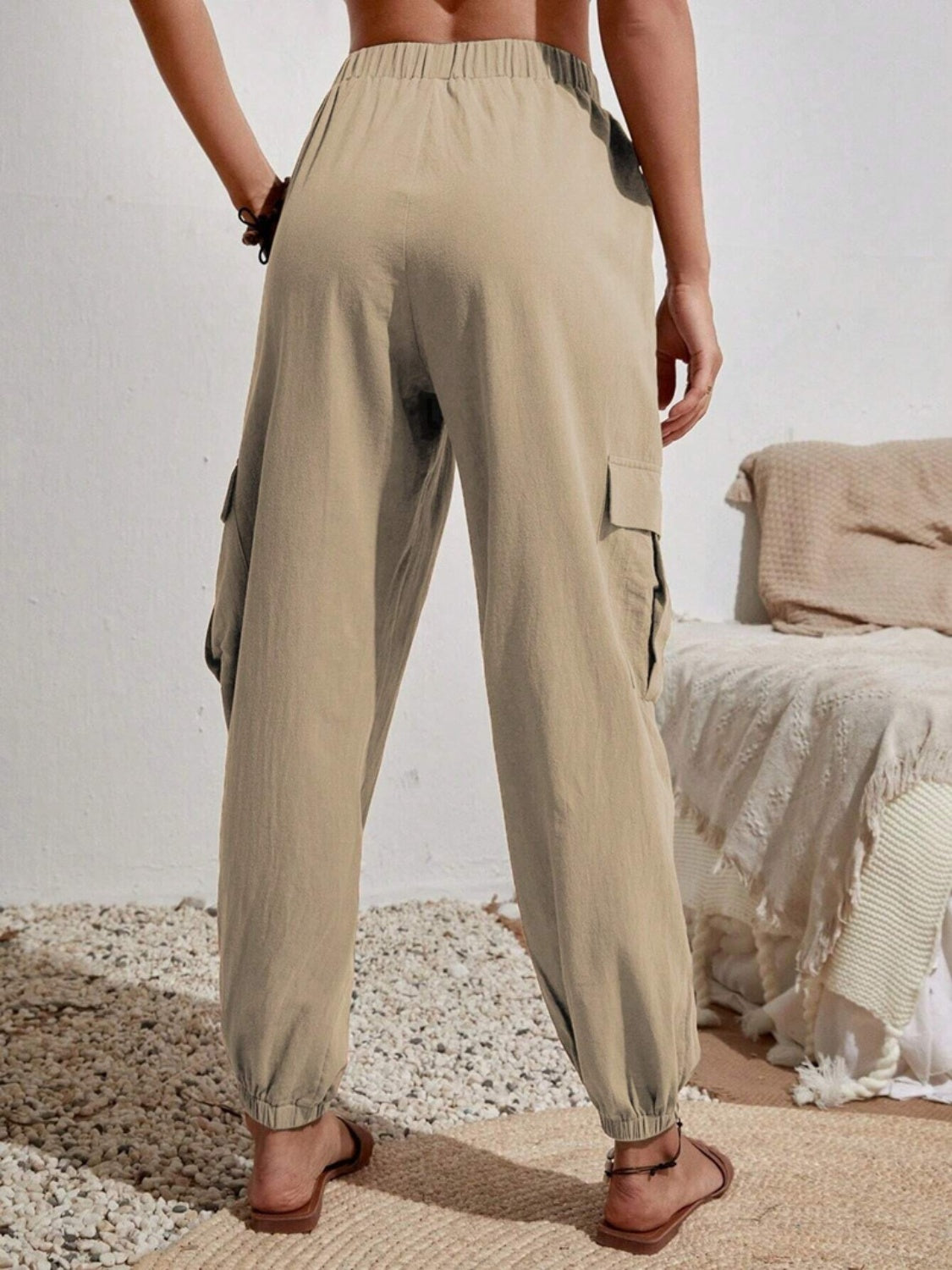 Drawstring joggers with cargo pockets, opaque.