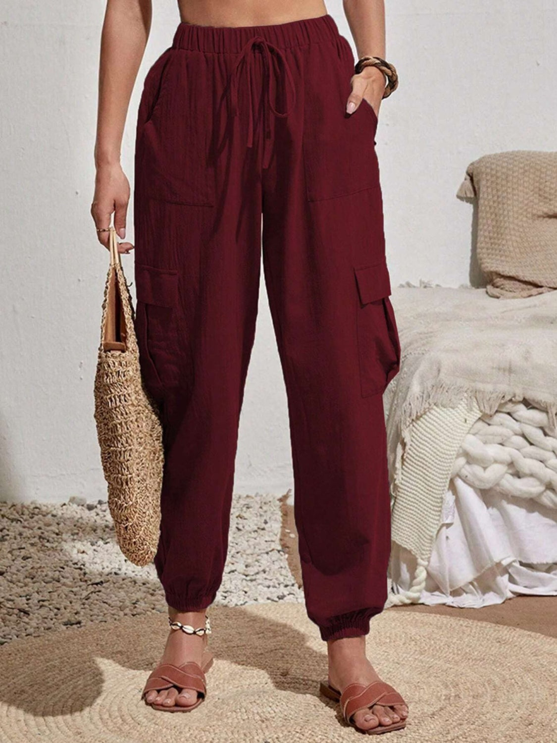 Drawstring joggers with cargo pockets, opaque.